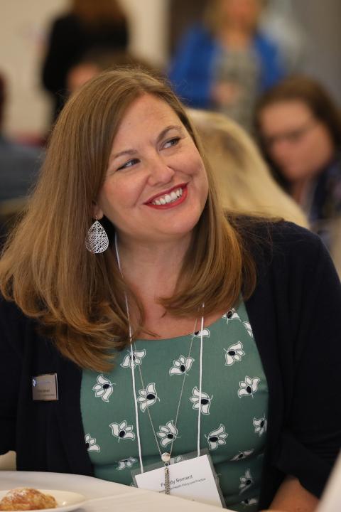 woman sitting at conference